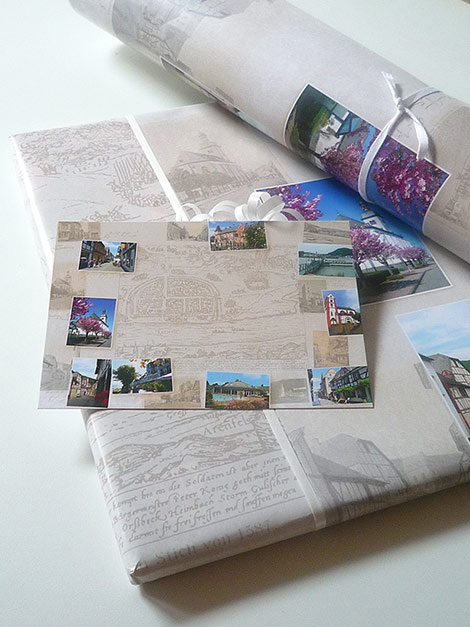 Geschenkpapier und Ansichtskarte mit Motiven des historischen und heutigen Bad Breisig